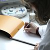 Schrijfblok Rhodia A5 lijn 80 vel 80gr met kantlijn oranje foto